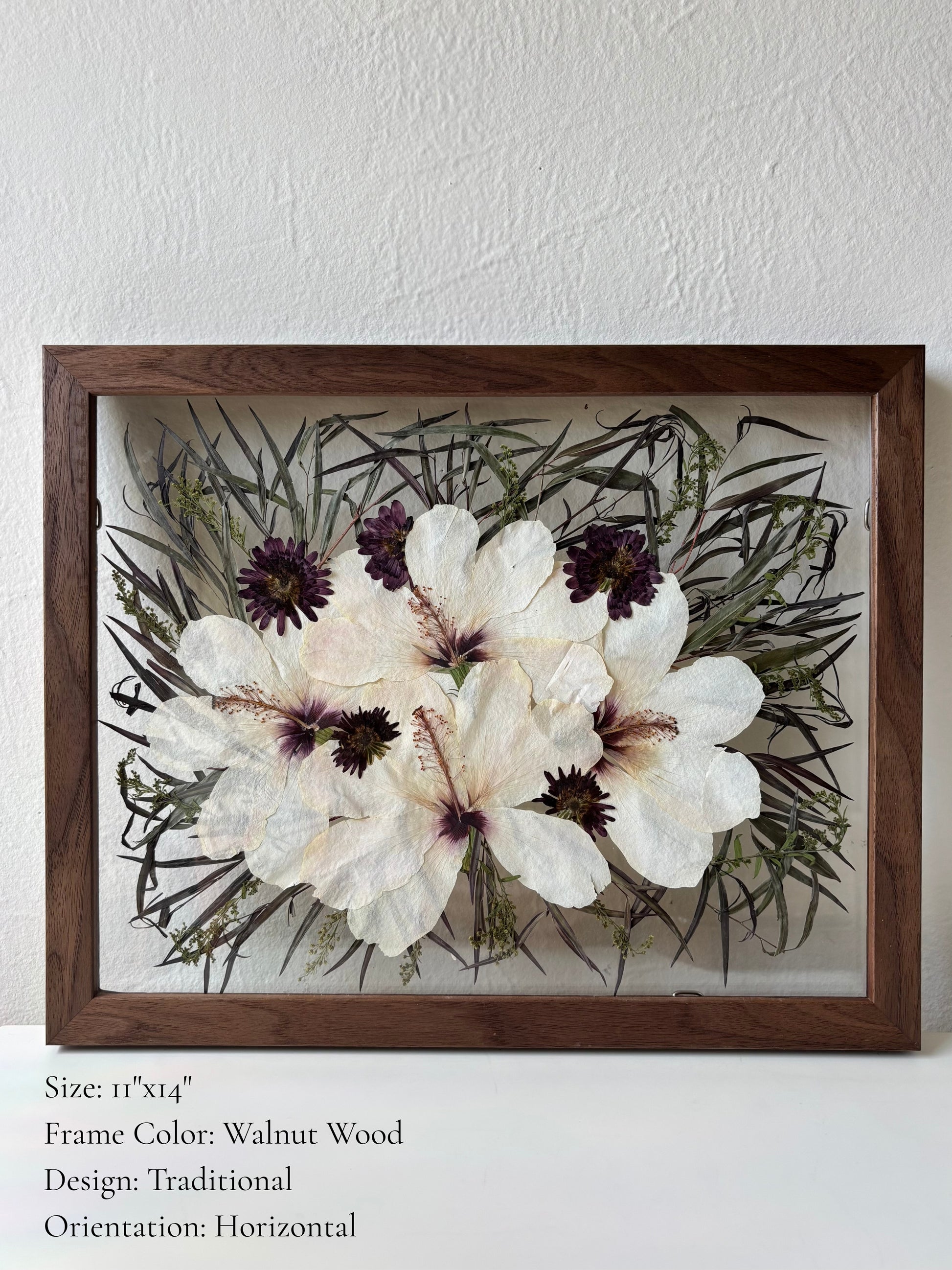Pressed wedding bouquet preserved in a custom walnut wood floating glass frame. Tropical flowers.
