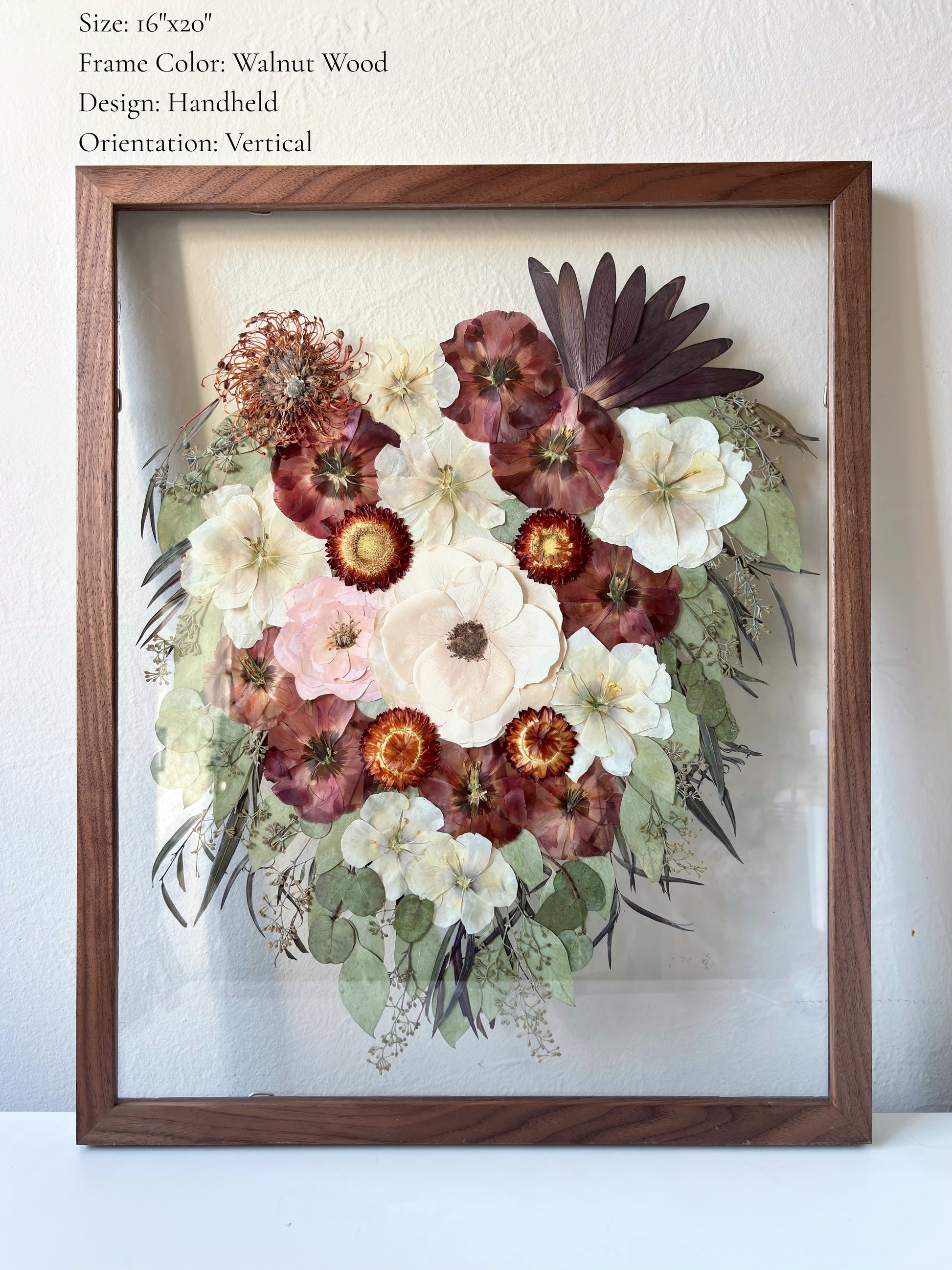 Wedding bouquet preservation framed in walnut wood with a handheld bouquet design. 