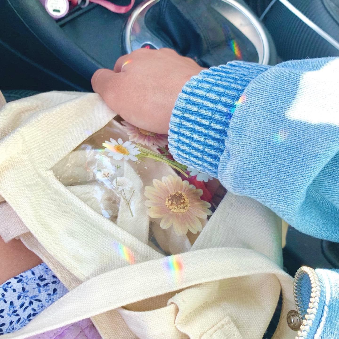Cute girly car decor. Rainbows decorating car interior.