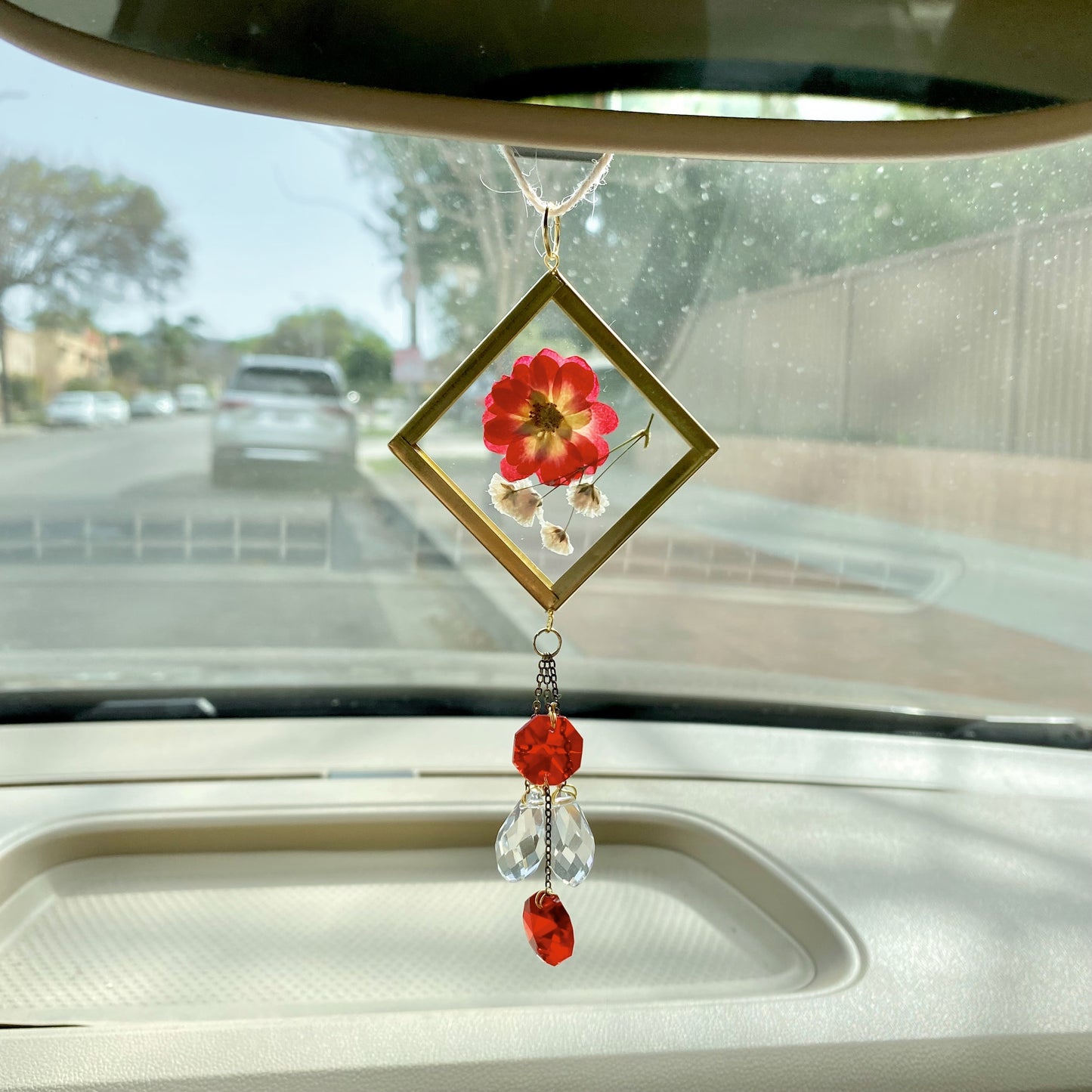 Girly red car decor. Handmade pressed flower sun catcher with red hanging crystals for car decor.